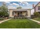 Charming home featuring a well-manicured lawn, inviting porch, and colorful facade, perfect for a cozy curb appeal at 4528 W 34Th Ave, Denver, CO 80212