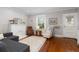 Inviting living room featuring hardwood floors, comfortable seating, and a bright atmosphere at 4528 W 34Th Ave, Denver, CO 80212