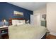 Comfortable main bedroom featuring a queen bed with a stylish headboard and bedside tables with lamps at 4528 W 34Th Ave, Denver, CO 80212