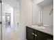 Hall bathroom features a shower-tub combo with tile flooring and a single sink vanity at 14850 Oslo Ave, Parker, CO 80134