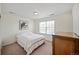 Modest bedroom with a bed, a dresser, neutral walls, and natural light at 14850 Oslo Ave, Parker, CO 80134