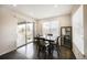 Bright dining room with a sliding door to the deck and views of the backyard at 14850 Oslo Ave, Parker, CO 80134
