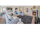 Open living area with a fireplace, adjacent to the kitchen and dining spaces at 14850 Oslo Ave, Parker, CO 80134