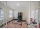 Dedicated office space featuring French doors, a desk, and ample natural light at 14850 Oslo Ave, Parker, CO 80134