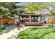 Wonderful home backyard featuring a large gazebo, bar, hot tub and professional landscaping at 1462 Marigold Dr, Lafayette, CO 80026