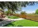 Spacious backyard featuring a gate to community park, professional landscaping and a gazebo at 1462 Marigold Dr, Lafayette, CO 80026