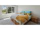 Serene bedroom with large window, providing natural light and a view of the outdoors at 1462 Marigold Dr, Lafayette, CO 80026