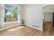 Bright dining area with wood floors and a large window offering backyard views and natural light at 1462 Marigold Dr, Lafayette, CO 80026