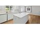 Open kitchen with island, stainless steel appliances, and plenty of counter space for cooking at 1462 Marigold Dr, Lafayette, CO 80026