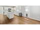 Modern kitchen with white cabinets, countertops, island, and stainless-steel appliances at 1462 Marigold Dr, Lafayette, CO 80026