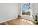 Bright, airy living room features wood floors and a large window with views of the outdoors at 1462 Marigold Dr, Lafayette, CO 80026