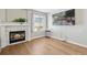 Cozy living room with fireplace and television mounted on the wall for entertainment at 1462 Marigold Dr, Lafayette, CO 80026