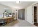 Finished basement office space with natural light and gray carpet at 1462 Marigold Dr, Lafayette, CO 80026