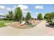 Community park featuring a playground, mature trees, green space and a covered gazebo at 1462 Marigold Dr, Lafayette, CO 80026