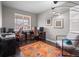 Bright home office featuring two desks, a stylish accent rug, and comfortable seating by the window at 17077 E 111Th Ave, Commerce City, CO 80022