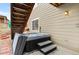 Hot tub with stairs and cover featured on the outdoor patio at 17077 E 111Th Ave, Commerce City, CO 80022