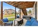 Inviting covered patio featuring a fire pit, outdoor seating, and a hot tub at 17077 E 111Th Ave, Commerce City, CO 80022