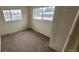 Bright bedroom with two windows, neutral carpet and baseboard trim at 3607 W 80Th Ave, Westminster, CO 80030