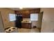 Functional kitchen featuring classic wood cabinets, a refrigerator, and stainless steel double-basin sink at 3607 W 80Th Ave, Westminster, CO 80030