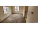 Well-lit living room with neutral carpet, ample windows and an open layout at 3607 W 80Th Ave, Westminster, CO 80030