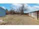 Spacious backyard, partially fenced with sparse vegetation and potential for landscaping at 20091 E Bellewood Dr, Centennial, CO 80015