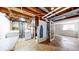 View of the basement with laundry machines and unfinished utility area at 20091 E Bellewood Dr, Centennial, CO 80015