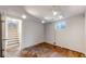 Spacious basement room with modern track lighting and stairs at 20091 E Bellewood Dr, Centennial, CO 80015