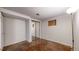Basement bedroom includes built-in wardrobe, window and overhead lighting at 20091 E Bellewood Dr, Centennial, CO 80015