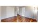 Bright bedroom featuring hardwood floors, closet, and natural lighting at 20091 E Bellewood Dr, Centennial, CO 80015