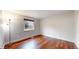 Bedroom featuring hardwood floors, soft lighting and a window at 20091 E Bellewood Dr, Centennial, CO 80015