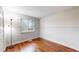 Serene bedroom showcasing hardwood floors, soft lighting, and neutral wall tones at 20091 E Bellewood Dr, Centennial, CO 80015