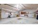 Spacious garage with pegboard and cabinets for organized storage of tools at 20091 E Bellewood Dr, Centennial, CO 80015