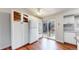 Eat-in kitchen with white cabinetry, stainless steel appliances, and access to the backyard at 20091 E Bellewood Dr, Centennial, CO 80015