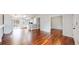 Open living space featuring wood floors, a modern staircase, and abundant natural light at 20091 E Bellewood Dr, Centennial, CO 80015