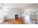 Spacious living room with hardwood floors, a cozy fireplace, and a skylight at 20091 E Bellewood Dr, Centennial, CO 80015