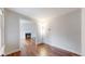 Cozy living room with hardwood floors, fireplace, and soft natural lighting at 20091 E Bellewood Dr, Centennial, CO 80015
