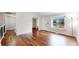 Open living space featuring wood floors, a modern staircase, and abundant natural light at 20091 E Bellewood Dr, Centennial, CO 80015