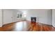 Inviting living room with hardwood floors, natural light, and a cozy fireplace at 20091 E Bellewood Dr, Centennial, CO 80015