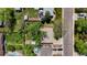 This is an aerial view of a home with a spacious backyard and charming landscaping at 8022 S Jay Dr, Littleton, CO 80128