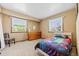 Bedroom featuring large windows, lots of light, and a chest of drawers at 8022 S Jay Dr, Littleton, CO 80128