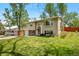 Charming home with a well-maintained lawn and mature trees at 8022 S Jay Dr, Littleton, CO 80128