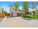 Split level home with a basketball hoop, nice yard and mature trees at 8022 S Jay Dr, Littleton, CO 80128