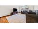 Living room with hardwood floors, an area rug, and comfortable couches at 8022 S Jay Dr, Littleton, CO 80128