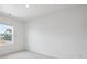 A bright bedroom with white walls and trim, carpeted floors, and a window to the outside at 22363 E 6Th Pl, Aurora, CO 80018