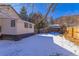 Snow covered backyard with privacy fence at 202 Lower Glenway St, Palmer Lake, CO 80133