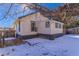 The home's backyard is covered in snow at 202 Lower Glenway St, Palmer Lake, CO 80133