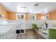 Finished basement includes laundry area, seating area, and staircase at 202 Lower Glenway St, Palmer Lake, CO 80133