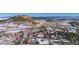 Overview of a charming town set amid a scenic landscape with rolling hills and trees at 202 Lower Glenway St, Palmer Lake, CO 80133