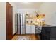 Efficient kitchen showcasing modern appliances and open shelving, perfect for a chef at 202 Lower Glenway St, Palmer Lake, CO 80133