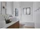 Bright bathroom features double vanity, vessel sinks, a window over the tub, and modern fixtures at 2415 Urban St, Lakewood, CO 80215